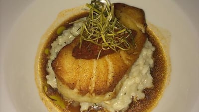 Chilean sea bass served on a bed of rock shrimp risotto and lobster broth. Part of the summer menu at Caramel, DIFC. Photo by Rebecca McLaughlin-Duane