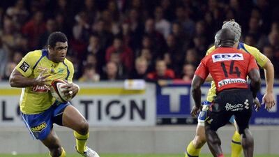 Clermont's Fijian winger Napolioni Nalaga, left, challenges Oyonnax's French wing Dug Codjo during Clermont's Top 14 victory over Oyonnax on Saturday. Philippe Merle / AFP / September 27, 2014