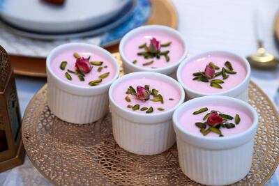 Pots of rose falooda dessert are among the delicacies on the family’s iftar table Victor Besa / The National