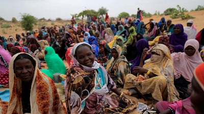 Harana Souleymane, a Sudanese woman seeking refuge in Chad for a second time, waits to receive food aid. Reuters