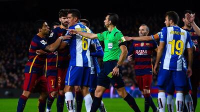 Luis Suarez of Barcelona, left, argues with Espanyol players during the Copa del Rey Round of 16 first leg match between Barcelona and Espanyol at Camp Nou on January 6, 2016 in Barcelona, Spain. (Photo by David Ramos/Getty Images)