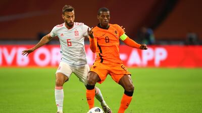 Netherlands' midfielder Georginio Wijnaldum on the ball under pressure from Spain defender Mario Hermoso. AFP