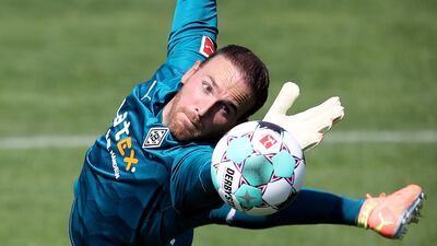 Tobias Sippel saves a ball during the first training session after the summer break, in Moenchengladbach, Germany. Getty Images