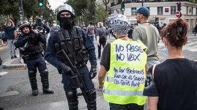 A protester wearing a yellow vest is seen at a demonstration in Paris against the French Covid-19 health pass. EPA