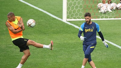 Tottenham Hotspur's Hugo Lloris clears the ball from Richarlison. Reuters