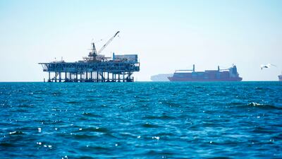 Cargo vessels are anchored offshore before heading into the Los Angeles-Long Beach port. Environmentalists have long complained about poor federal oversight of pipeline companies. AP
