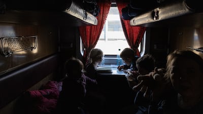Orphaned children who fled the Russian-occupied Ukrainian town of Polohy wait in an evacuation train before leaving for the western part of Ukraine last month. EPA