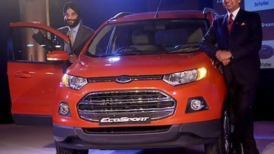 President and managing director of Ford India, Joginder Singh (L), and Vinay Piparsania, executive director for marketing sales and service, pose with newly launched Ford EcoSport in New Delhi. Prakash Singh / AFP