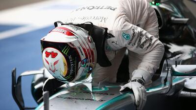 Lewis Hamilton of Mercedes kisses his car in celebration after winning the Belgian Grand Prix on Sunday. Paul Gilham / Getty Images