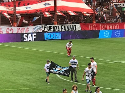 Argentine veterans of the Falklands War unveil a flag during match at the Diego Armando Maradona Stadium in 2019. Photo: Andy Mitten for The National