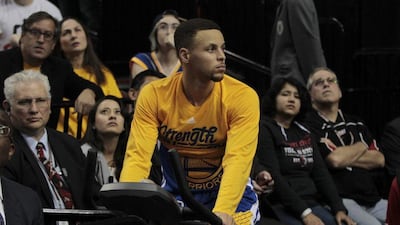Golden State Warriors guard Stephen Curry stays warm on an exercise bike during the first half of Game 4 of the NBA Western Conference semi-finals basketball game between the Golden State Warriors and the Portland Trail Blazers at the Moda Center in Portland, Oregon USA, 09 May 2016. Steve DiPaola / EPA
