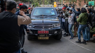 Indian Army chief Gen Manoj Mukund Naravane arrives at Gen Rawat's residence. AP Photo