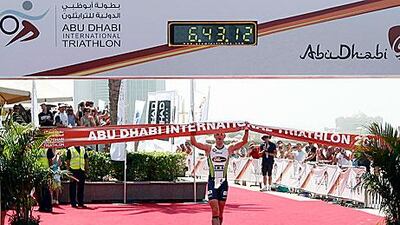 Frederik van Lierde celebrates as he crosses the line during the Abu Dhabi International Triathlon in the capital.