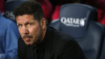 Atletico Madrid manager Diego Simeone looks on before the match against Barcelona. Pau Barrena / AFP