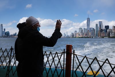 The Manhattan skyline in the distance as people ride the Staten Island Ferry, which commutes between Staten Island and Manhattan, May 09, New York City. Spencer Platt/Getty /AFP