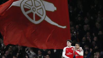 Alexis Sanchez celebrates with Hector Bellerin after scoring the third goal in a 3-0 Champions League win on Tuesday at the Emirates Stadium. Stefan Wermuth / Reuters