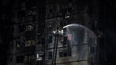 Civil Defence forces extinguish the fire. EPA