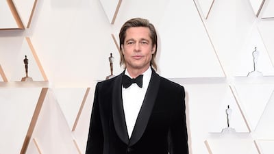 Brad Pitt arrives, wearing Brioni, at the Oscars on Sunday, February 9, 2020, at the Dolby Theatre in Los Angeles. AP
