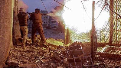 1st prize, Spot News Stories: Syrian rebels fire a rocket-propelled grenade towards a government controlled army checkpoint in the Ain Tarma neighborhood of Damascus. After evacuating their comrade, who died from army sniper fire, the rebels returned to attack the army checkpoint but would soon be hit by tank shelling. Goran Tomasevic / Reuters