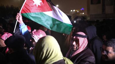 Protestors demanded reforms in various fields during a protest under a heavy rain, in Amman. EPA