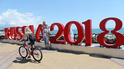 Russians pose next to a Fifa World Cup 2018 logo close to Sochi stadium in Sochi, Russia. EPA