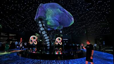 A man takes a video inside the Russia pavilion. AP