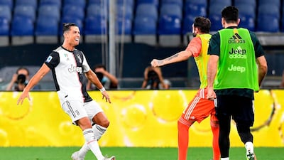 Cristiano Ronaldo, left, celebrates after scoring against Genoa. AP Photo
