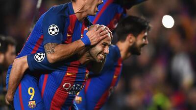 Luis Suarez and Javier Mascherano celebrate the victory at full time. Laurence Griffiths / Getty Images
