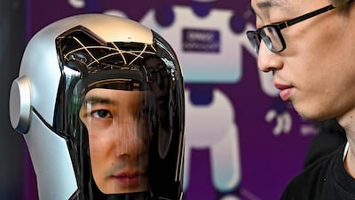 A visitor looks at a humanoid robot at the China Humanoid Robot Developers Conference in Shanghai. AFP