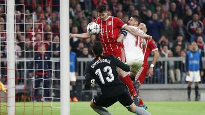 Robert Lewandowski narrowly fails to score against Sevilla goalkeeper David Soria. Alex Grimm/Bongarts/Getty Images