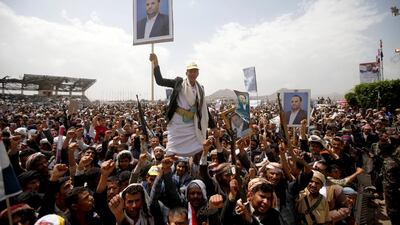 Houthi supporters hold posters of Saleh Al Samad, a senior Houthi official, during a funeral procession held for him and his six body guards, killed by Saudi-led air strikes last week, in Sanaa, Yemen