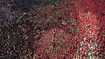 Members of the “Colla Vella Xiquets de Valls” human tower team form a “castell” during the XXV human towers, or castells, competition in Tarragona. These human towers, built traditionally in festivals within Catalonia, gather several teams that attempt to build and dismantle a tower structure. Josep Lago / AFP