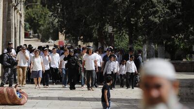 Israeli security forces escort a group of Jewish settlers visiting the Al Aqsa Mosque compound in the Old City of Jerusalem on June 2, 2019, as Israelis mark Jerusalem Day. AFP