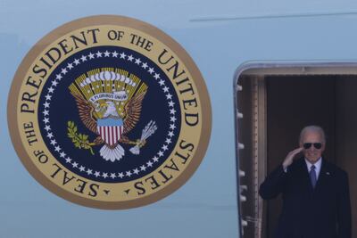 Former president Joe Biden salutes while boarding Air Force One at Joint Base Andrews. Getty / AFP
