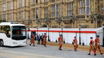 Yeomen of the Guard arrive by bus outside the Palace of Westminster, better known as the Houses of Parliament. PA