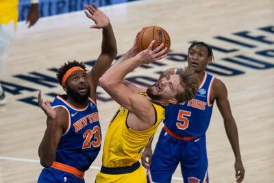 Indiana Pacers forward Domantas Sabonis shoots as New York Knicks' Mitchell Robinson defends. USA Today
