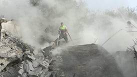 Civil defence members battle fire at the site an Israeli air strike that targeted a building in the southern Lebanese village of Ain Qana earlier this month. AFP