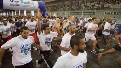 Participants of the 10km ADNIC Yas Run at Yas Marina Circuit, Abu Dhabi yesterday. Ravindranath K / The National