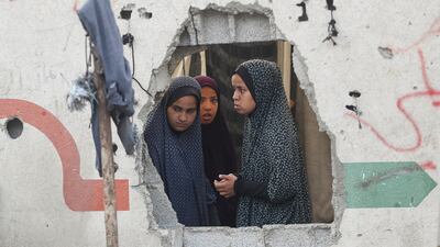 Palestinians inspect the site of a strike on a school in Gaza city that was sheltering displaced people. Reuters