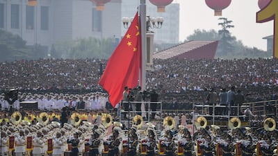 A Chinese national flag is raised. AFP