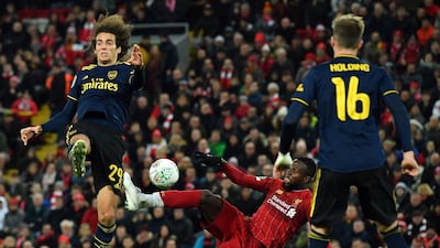 Liverpool striker Divock Origi, centre, scores his team's fifth goal. AFP