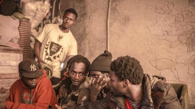 Sub-Saharan migrants sit in a tent they share at Ouled Ziane camp in Casablanca, Morocco. AP