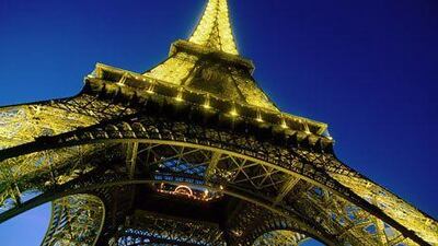 The Eiffel Tower will be dimmed come July as France tackles light pollution by curbing unnecessary use at night. John Elk / Getty Images