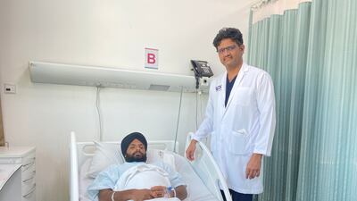 Indian carpenter Balkar Singh, 27, is examined by urologist Dr Althaf Hussain, who used laser therapy to remove 40 kidney stones at Lifecare Hospital in Mussaffah. Photo: VPS Healthcare