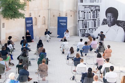 The Otolith Group in conversation with exhibition curator Annie Fletcher, left, at Hamdan Bin Mousa Square. Sharjah Art Foundation, Sharjah, 2021. Photo: Shanavas Jamaluddin