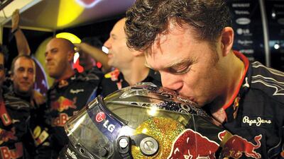 A mechanic kisses the helmet of Sebastian Vettel of Germany and Red Bull Racing after winning the driver's championship during the Abu Dhabi Formula One Grand Prix at the Yas Marina Circuit in 2010. Getty