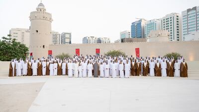 On the first row from right to left, Sheikh Mansour bin Mohamed bin Rashid; Sheikh Hazza bin Zayed, deputy chairman of the Abu Dhabi Executive Council; Sheikh Ahmed bin Mohamed bin Rashed; Sheikh Saif bin Mohamed; Sheikh Tahnoun bin Mohamed, Ruler's Representative in Al Ain Region; Sheikh Mohamed bin Zayed, Crown Prince of Abu Dhabi and Deputy Supreme Commander of the Armed Forces; Sheikh Hamdan bin Zayed, Ruler’s Representative in Al Dhafra Region; Sheikh Saeed bin Zayed, Abu Dhabi Ruler's Representative; Sheikh Hamdan bin Mansour bin Zayed; Sheikh Mansour bin Zayed, Deputy Prime Minister and Minister of Presidential Affairs; and Sheikh Mohamed bin Mansour bin Zayed stand for a photograph during a group wedding reception.