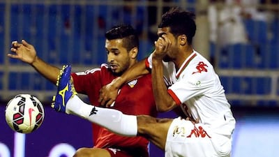 In the game against Oman, Ali Mabkhout, left, and fellow forwards found themselves trapped by the opposition players without getting support from the others in Riyadh, Saudi Arabia. Karim Sahib / AFP