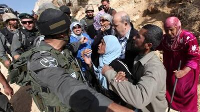 Palestinians clash with Israeli soldiers during a protest against Israel's separation barrier in the West Bank village of Walajeh.