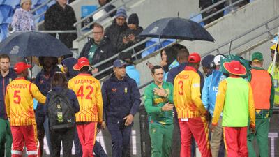 Zimbabwe and South African players shake hands after their T20 World Cup match in Hobart was called off due to rain. AFP